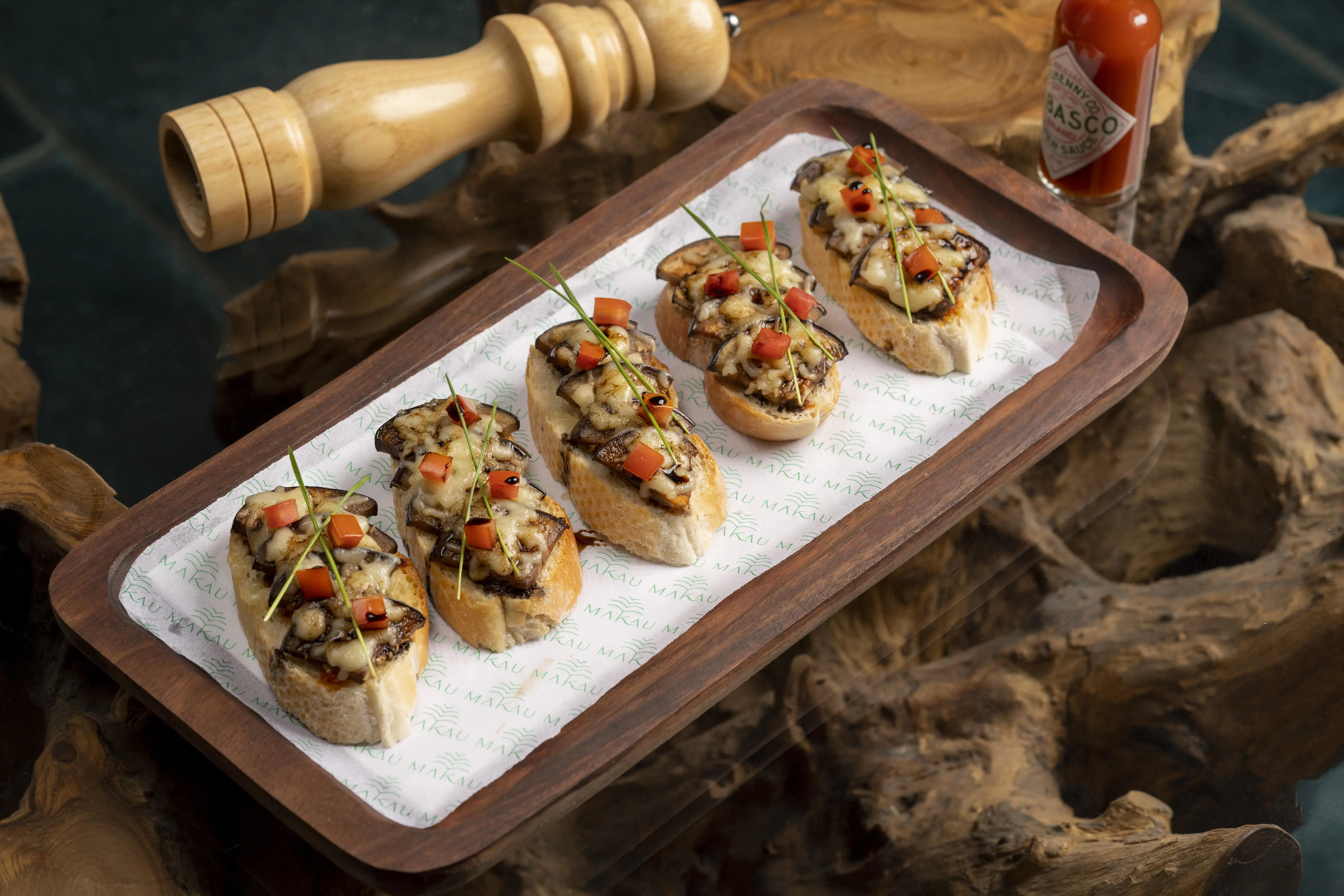 Photograph from Makau's own menu photography: a plated dish or drink from the kitchen and bar.